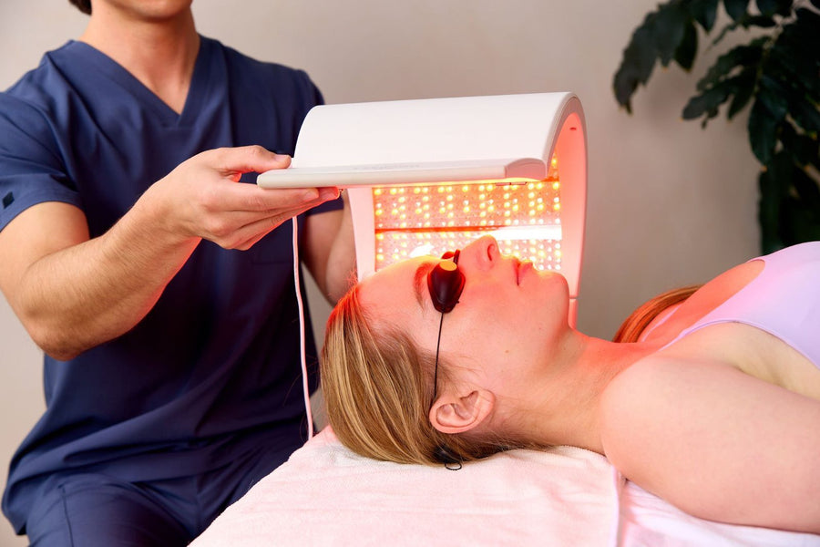 Esthetician holding Elipsa over a client wearing protective goggles